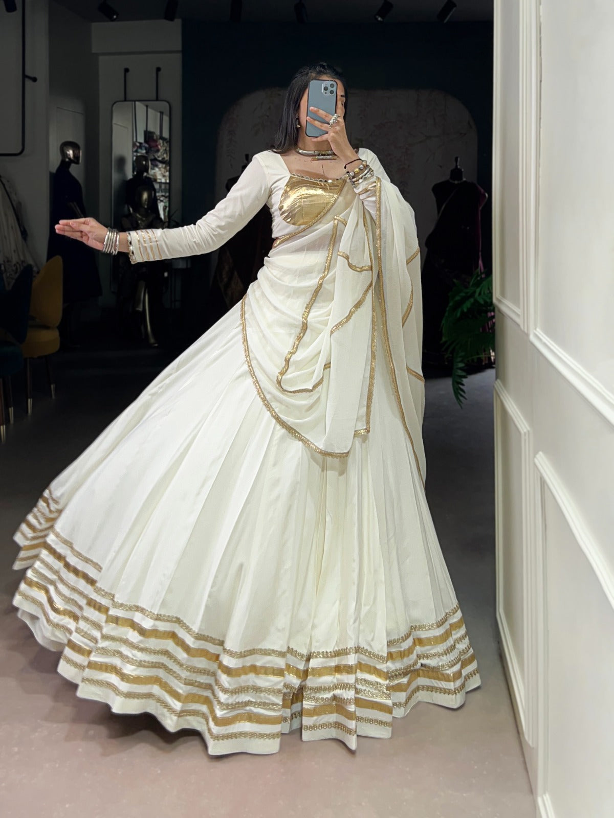 Regal White Lehenga Choli with Golden Zari Embellishments and Draped Dupatta