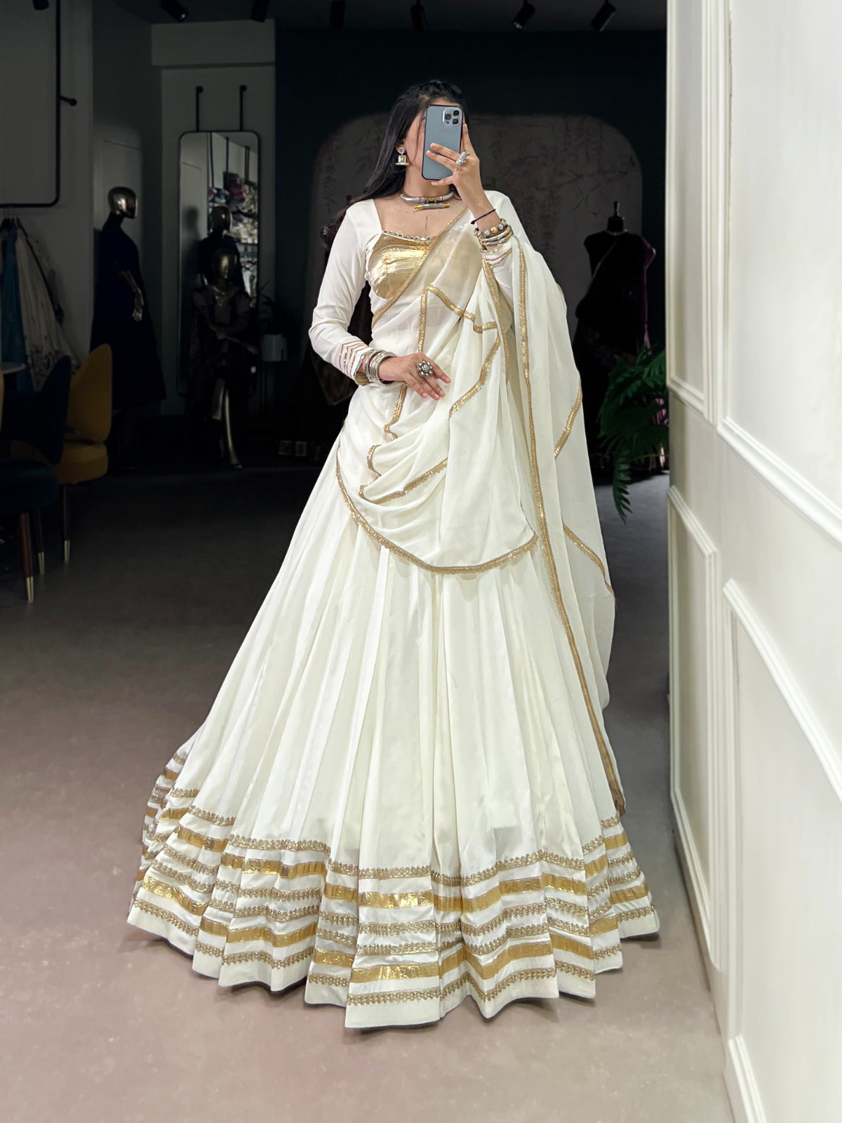 Regal White Lehenga Choli with Golden Zari Embellishments and Draped Dupatta