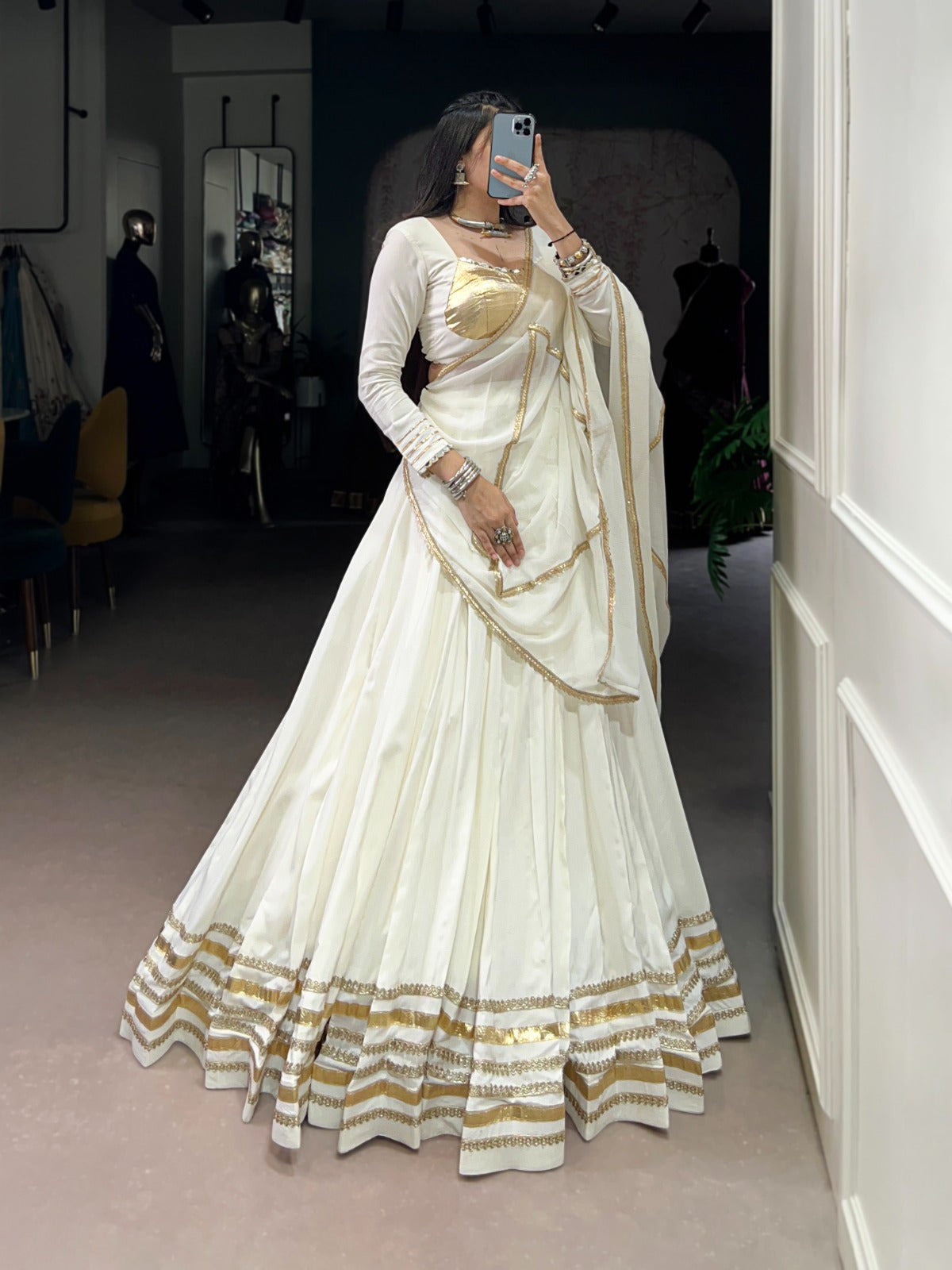 Regal White Lehenga Choli with Golden Zari Embellishments and Draped Dupatta