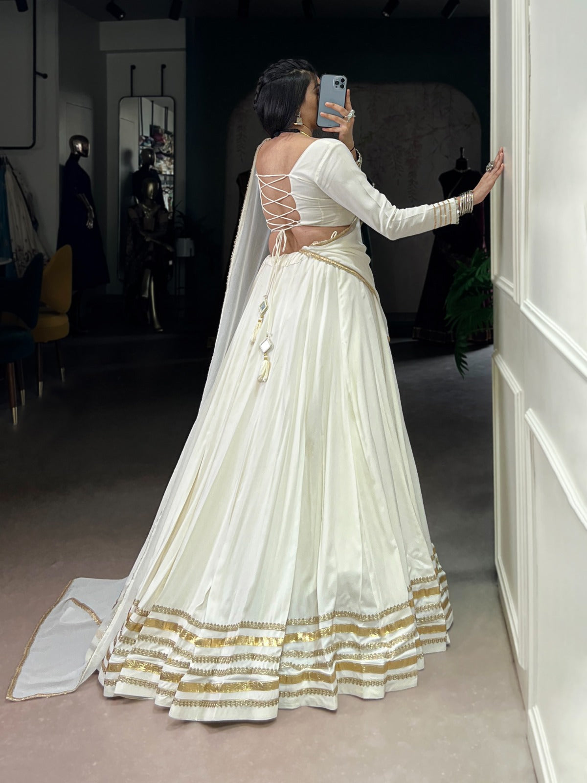 Regal White Lehenga Choli with Golden Zari Embellishments and Draped Dupatta