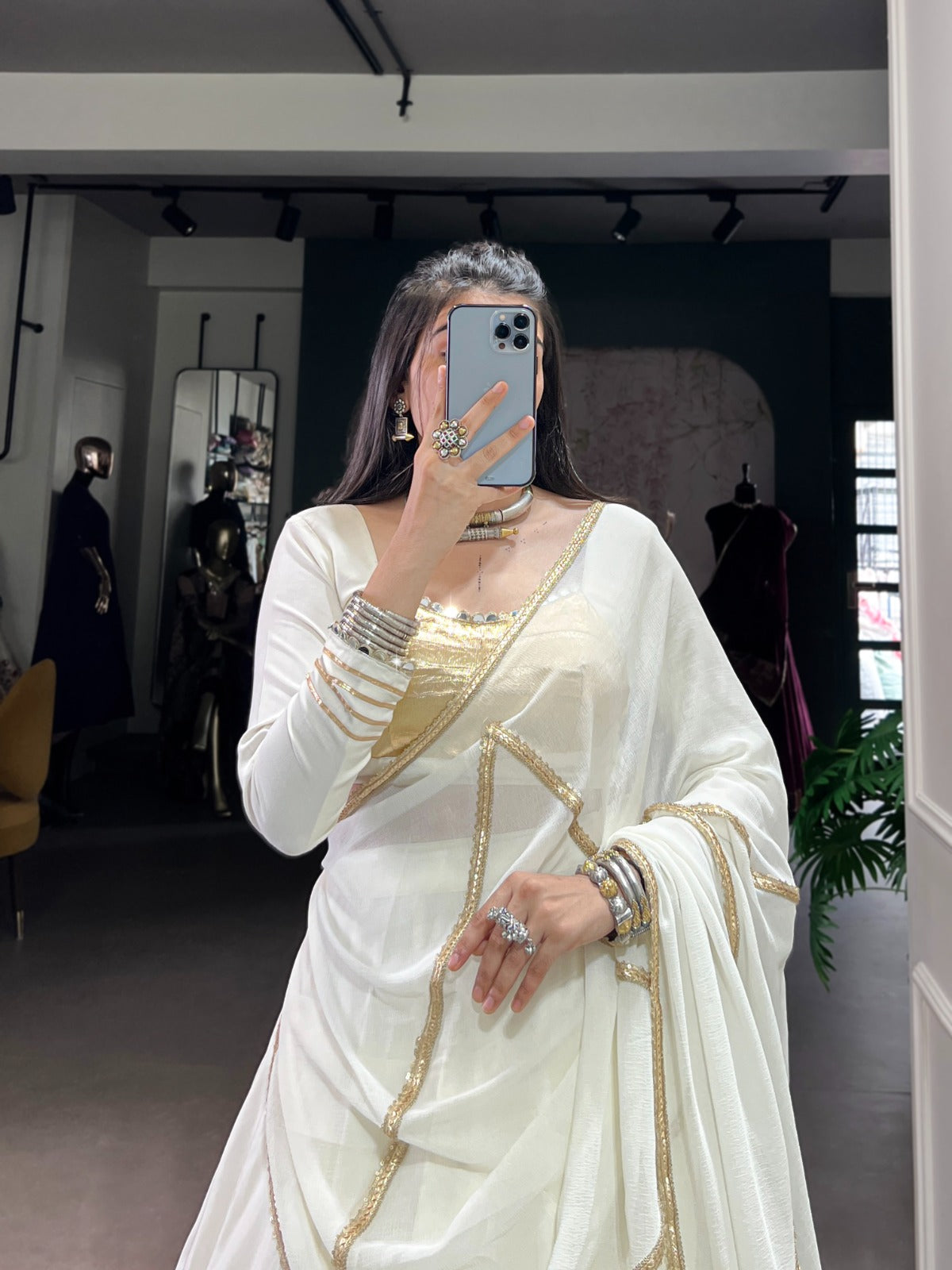 Regal White Lehenga Choli with Golden Zari Embellishments and Draped Dupatta