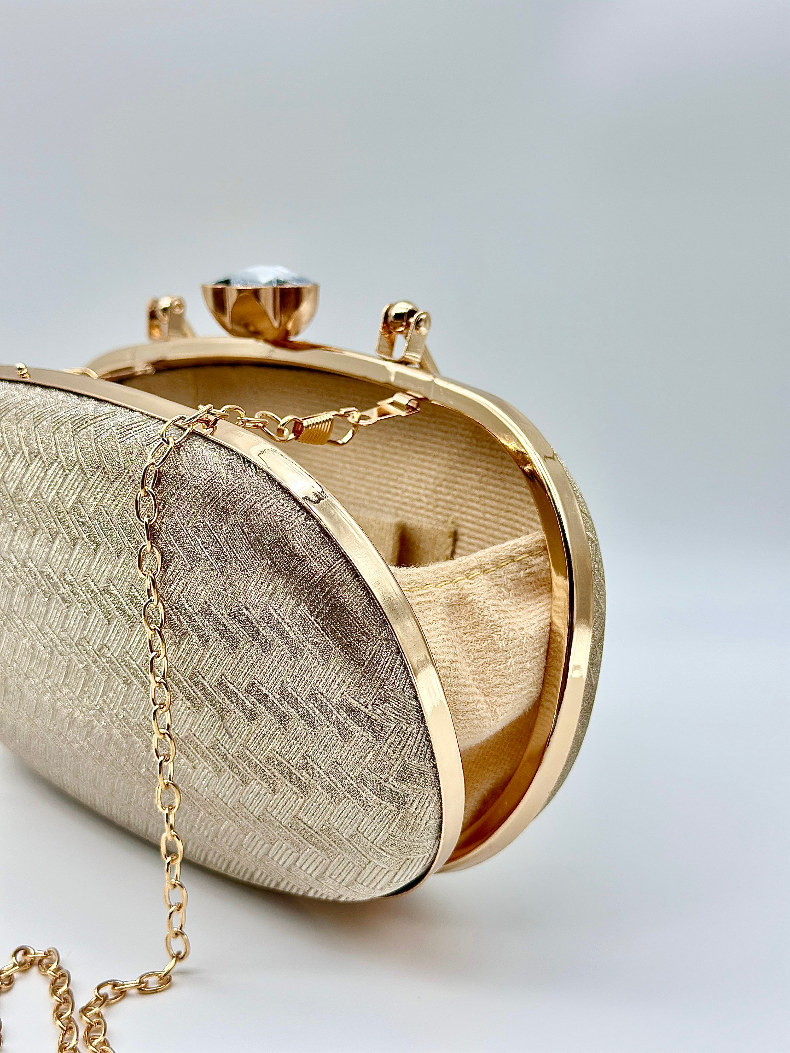 Golden Elegance Luxe Textured Oval Clutch