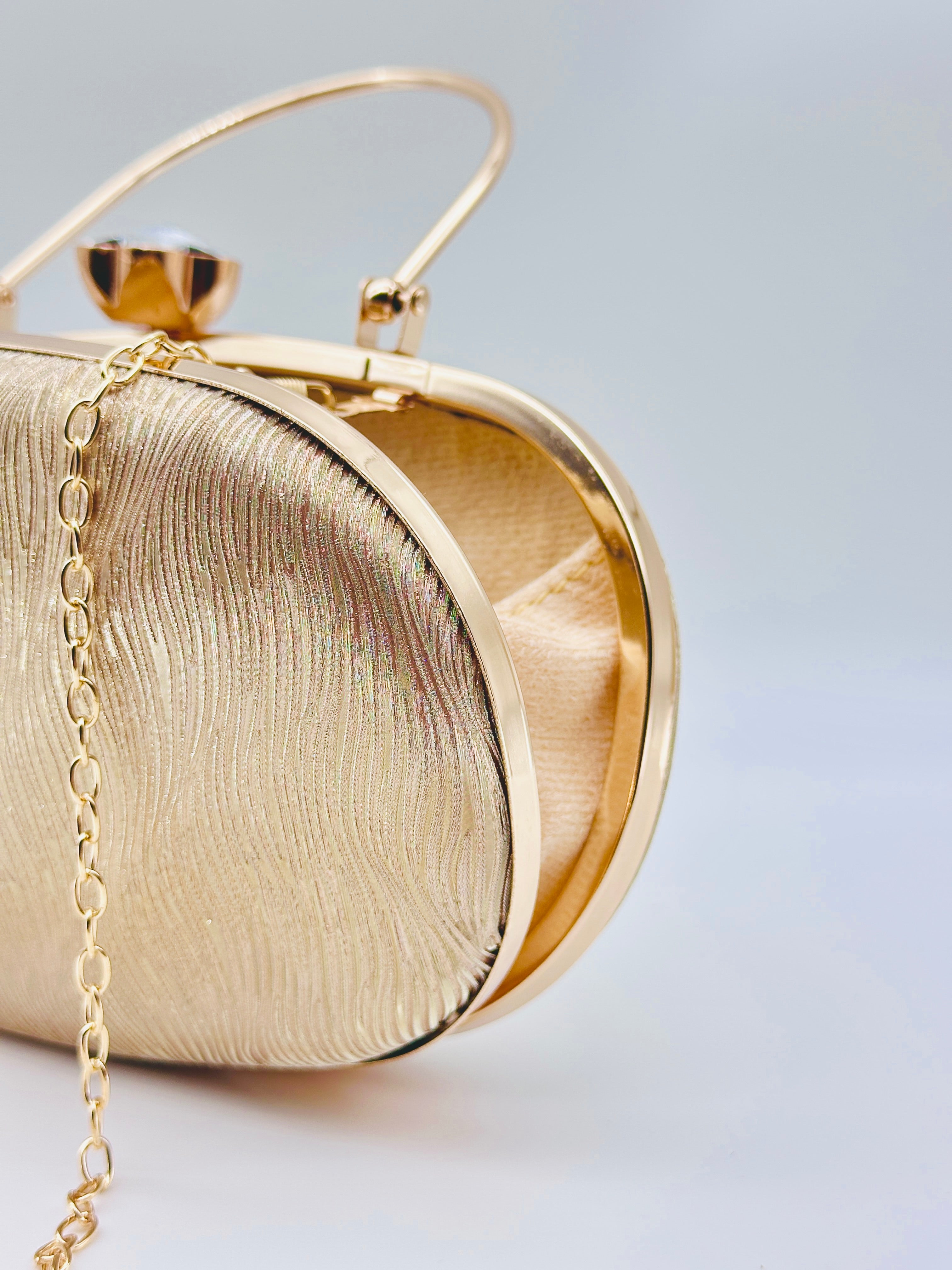 Golden Radiance Textured Oval Evening Clutch