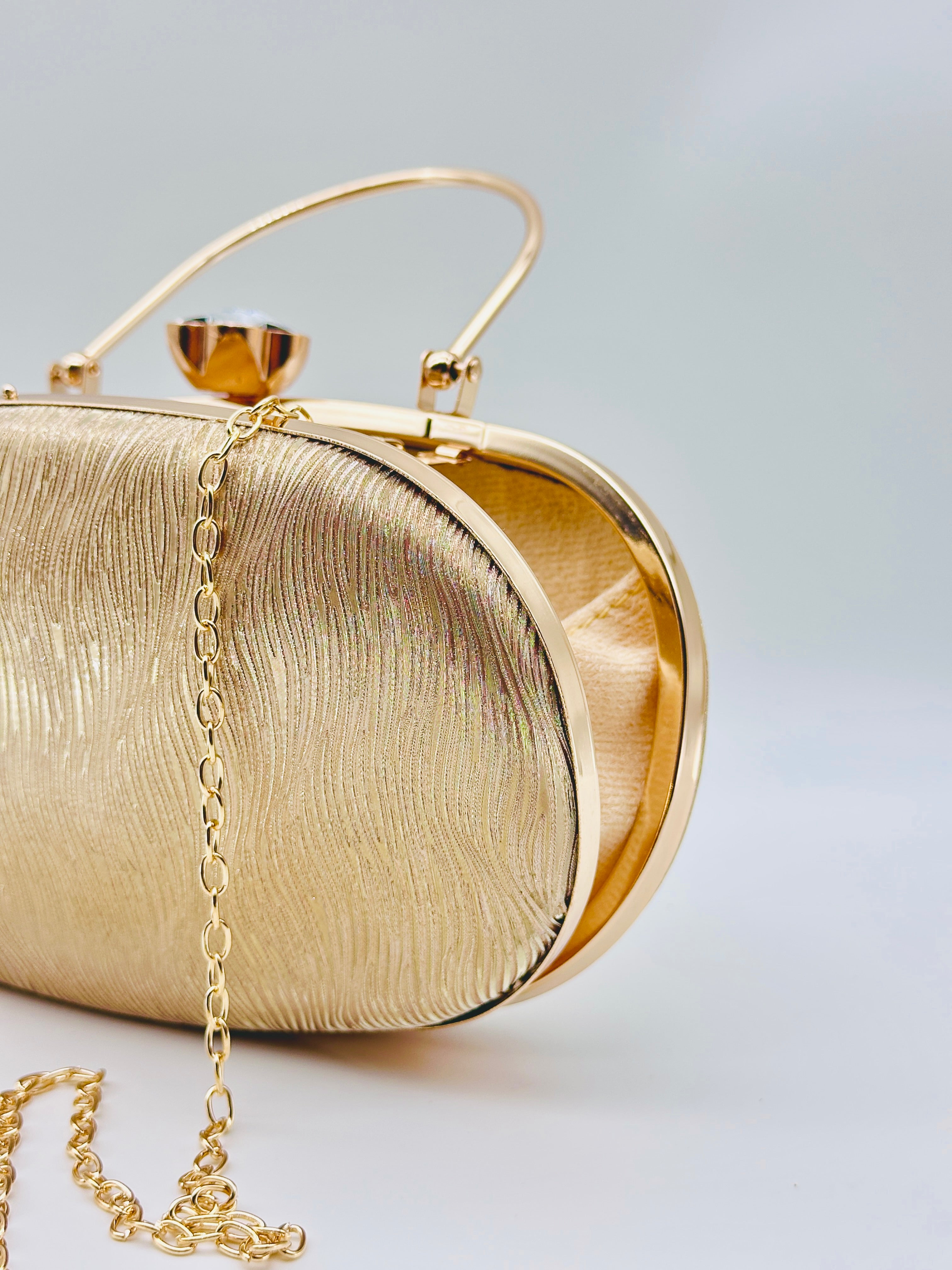 Golden Radiance Textured Oval Evening Clutch