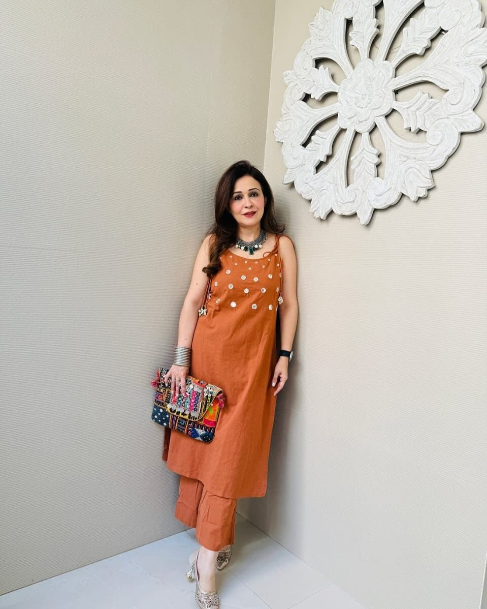 Orange Sleeveless Kurta Set with Embellished Detailing
